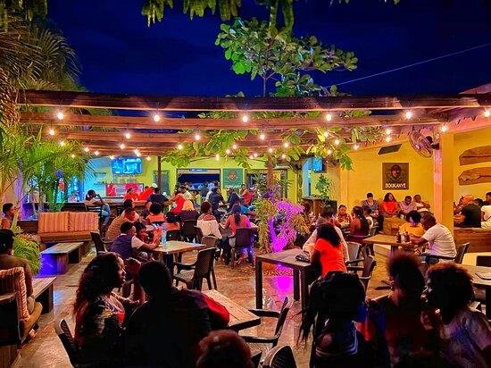Evening dinner under string lights at Boukanye
